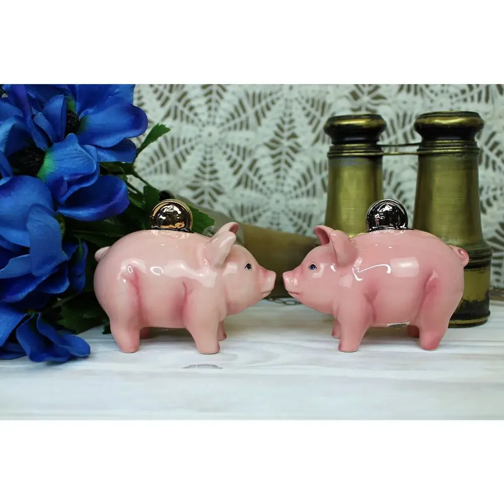 1999 Clay Art Pig Coins Salt and Pepper shakers.